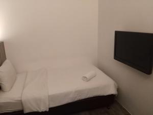 Postel nebo postele na pokoji v ubytování The Verve Hotel PJ Damansara