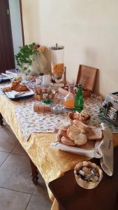 a table with bread and other food on it at Agriturismo Al Palazzo in Rivalta di Brentino