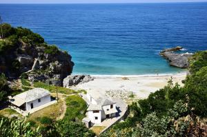 a view of a beach with houses and the ocean at Mylopotamos Beach House in Milopotamos