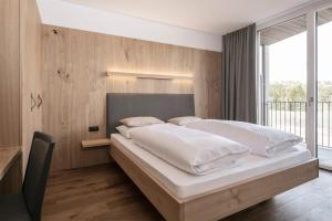 Posteľ alebo postele v izbe v ubytovaní Hotel Lichtenstern
