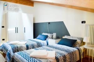 Ein Bett oder Betten in einem Zimmer der Unterkunft La Volta del Garda