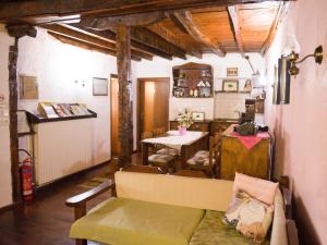 a living room with a couch and a table at Guesthouse Xenios Zeus in Stavroupoli