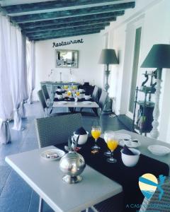 a living room with a table with drinks on it at A Casa di Mariano in Alata