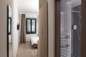 Postel nebo postele na pokoji v ubytování Hotel Vimbula - Komolac