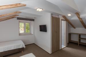 Postel nebo postele na pokoji v ubytování Hotel Vimbula - Komolac