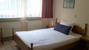 Postel nebo postele na pokoji v ubytování Hotel Janssen
