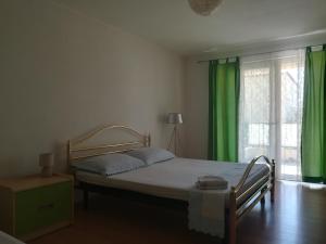 Кровать или кровати в номере Apartman Marija