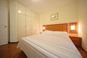 Posteľ alebo postele v izbe v ubytovaní Girica Apartments