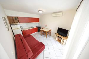 Televízia a/alebo spoločenská miestnosť v ubytovaní Girica Apartments