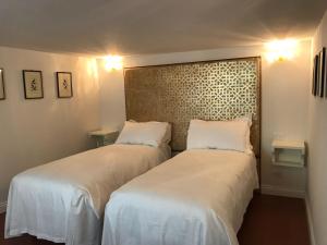Posteľ alebo postele v izbe v ubytovaní Suites alla Maddalena