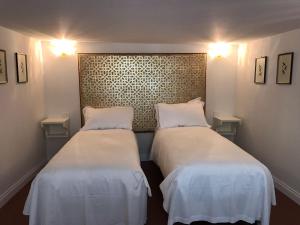 Posteľ alebo postele v izbe v ubytovaní Suites alla Maddalena