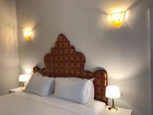 Posteľ alebo postele v izbe v ubytovaní Suites alla Maddalena