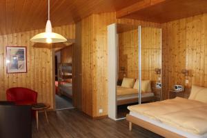 Lova arba lovos apgyvendinimo įstaigoje Hotel Alpha