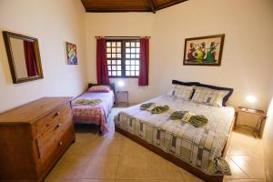 Ένα ή περισσότερα κρεβάτια σε δωμάτιο στο Pousada Canto No Bosque