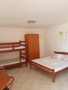 Postel nebo postele na pokoji v ubytování Apartments Denis