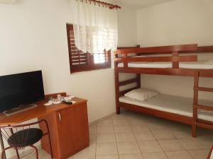 Кровать или кровати в номере Apartments Denis
