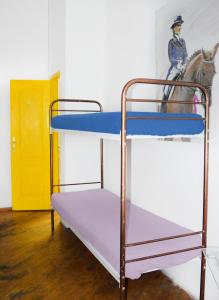 a bunk bed with a horse on top of it at Hostel Golden Gates in Kyiv