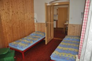 Een bed of bedden in een kamer bij Ubytování u Fanouše