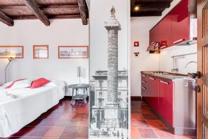 a kitchen and a bedroom with a bed and a stove at Romantic house with terrace in Rome