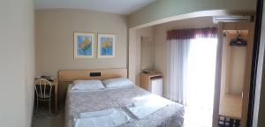 Säng eller sängar i ett rum på Hotel Da Vila