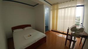 Postel nebo postele na pokoji v ubytování Hotel Santorini