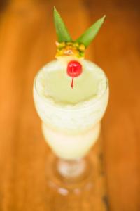 a close up of a drink with a garnishment at Hotel Delfin Playa Bejuco in Esterillos Este