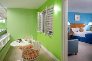 Rúm í herbergi á Deja Resort All Inclusive