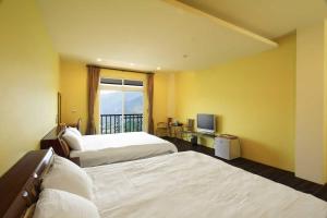 Letto o letti in una camera di Yun Meng Xianjing Homestay