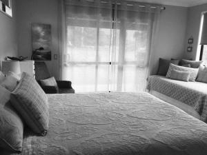 
a bedroom with a bed and a window at Abel Tasman Sands BnB in Marahau
