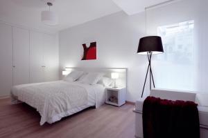 Posteľ alebo postele v izbe v ubytovaní 08028 Apartments
