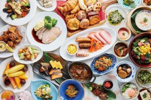 a table with many plates of food on it at Hotel Emion Tokyo Bay in Tokyo