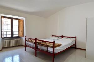 Posteľ alebo postele v izbe v ubytovaní Ostello del Parco di Monte Cucco