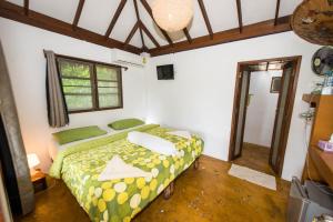 Postel nebo postele na pokoji v ubytování Oasis Koh Chang