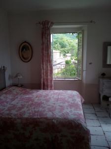 A bed or beds in a room at B&B La Locanda Di Cavoleto