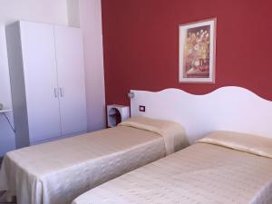 Postel nebo postele na pokoji v ubytování Hotel Sandalion