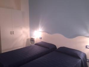 Postel nebo postele na pokoji v ubytování Hotel Sandalion