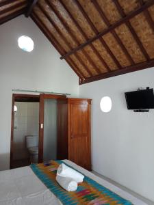 Giường trong phòng chung tại The Umah Prahu