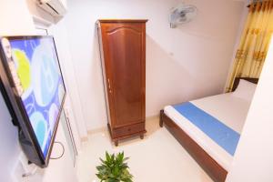 Postel nebo postele na pokoji v ubytování Thế Giang Hotel