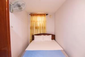 Postel nebo postele na pokoji v ubytování Thế Giang Hotel