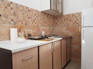 a kitchen with a sink and a counter top at Studio in Tivat