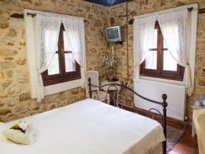 Posteľ alebo postele v izbe v ubytovaní To Archontiko Guesthouse Villa