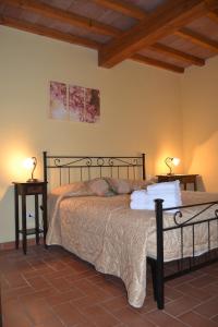En eller flere senge i et værelse på Agriturismo Beveraggio Appartamenti
