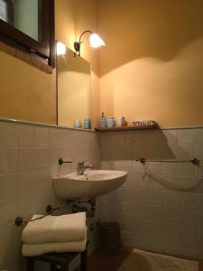 a bathroom with a sink and a mirror at Agriturismo Beveraggio Appartamenti in Marina di Grosseto +26 photos