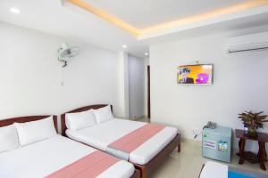 Postel nebo postele na pokoji v ubytování Thế Giang Hotel + 15 fotografií