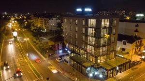 a city at night with a building and street lights at Hotel Union in Podgorica