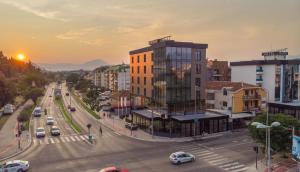 a view of a city with a street with cars at Hotel Union in Podgorica