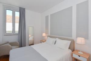 Uma cama ou camas num quarto em Oporto Lovely House