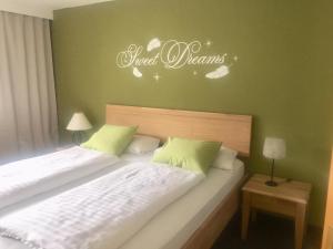 a bedroom with two beds and a sign that reads angel dreams at Ferienwohnung Stuibenfall in Jerzens