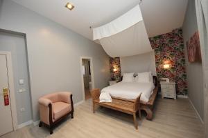 Ένα ή περισσότερα κρεβάτια σε δωμάτιο στο Hotel Château Viñasoro