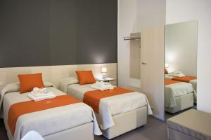 Postel nebo postele na pokoji v ubytování Porta Piccola Residence